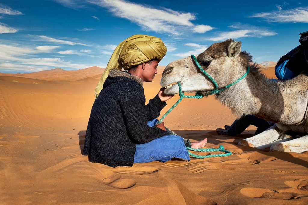 A young toureg boy and his camel